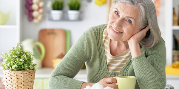Senior woman contemplating a life insurance policy transfer