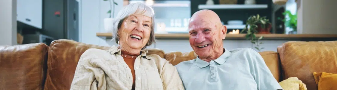 Retirement Services MSHP Landing Page Hero Image 1120 X 300 Senior couple discussing insurance options, representing the importance of senior insurance planning.