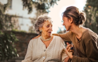 Senior woman smiling at dental checkup with Medicare dental coverage