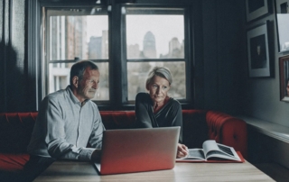 Elderly couple discussing life insurance options